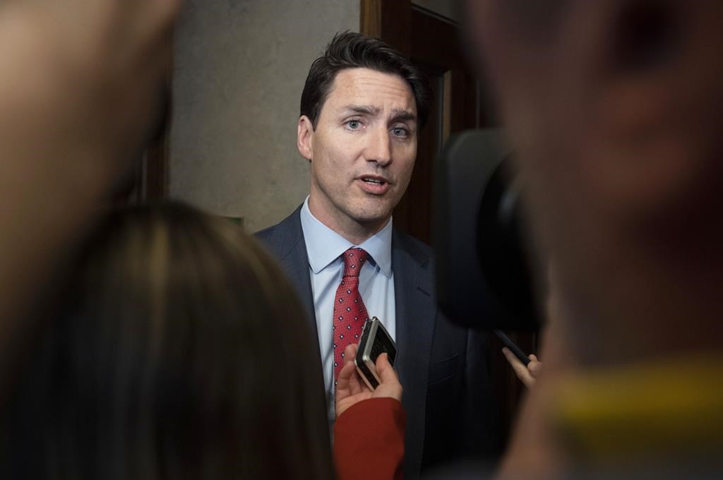 Prime Minister Justin Trudeau speaks to reporters as he leaves the House of Commons following the budget speech in the House of Commons on Parliament Hill in Ottawa on Tuesday, March 19, 2019.