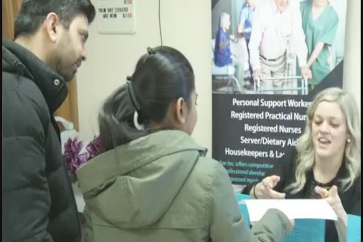 Job seekers and potential employers chat at Career Fair in Lakefield.