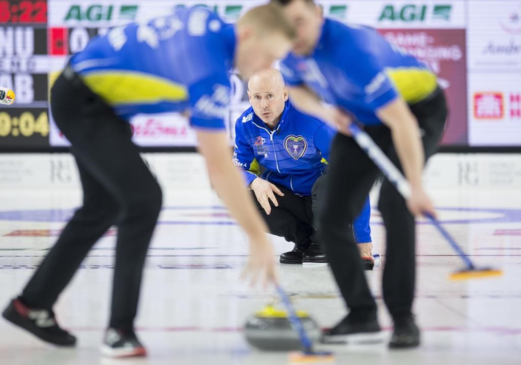 Team Alberta skip Kevin Koe looks on as lead Ben Hebert and second Colton Flasch sweep during the 12th draw against team Nunavut at the Brier in Brandon, Man. Wednesday, March 6, 2019. 
