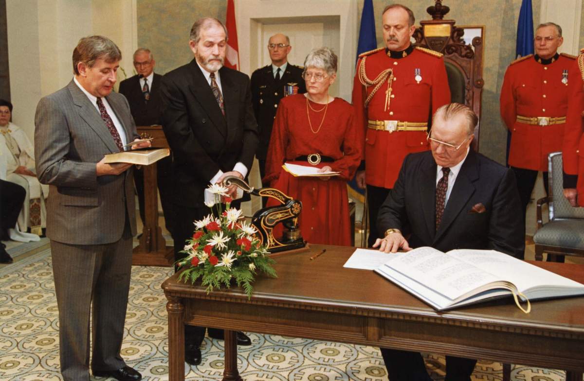 New Alberta Premier Ralph Klein (left) is sworn in by Alberta Lt. Governor Gordon Towers at Govermnent House in Edmonton, Dec. 14, 1992.