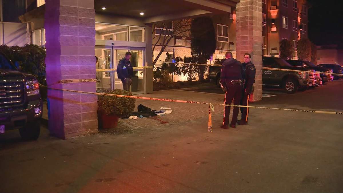 Langley RCMP investigate the scene of the stabbing in the parking lot of a popular bar and hotel early Saturday morning,
