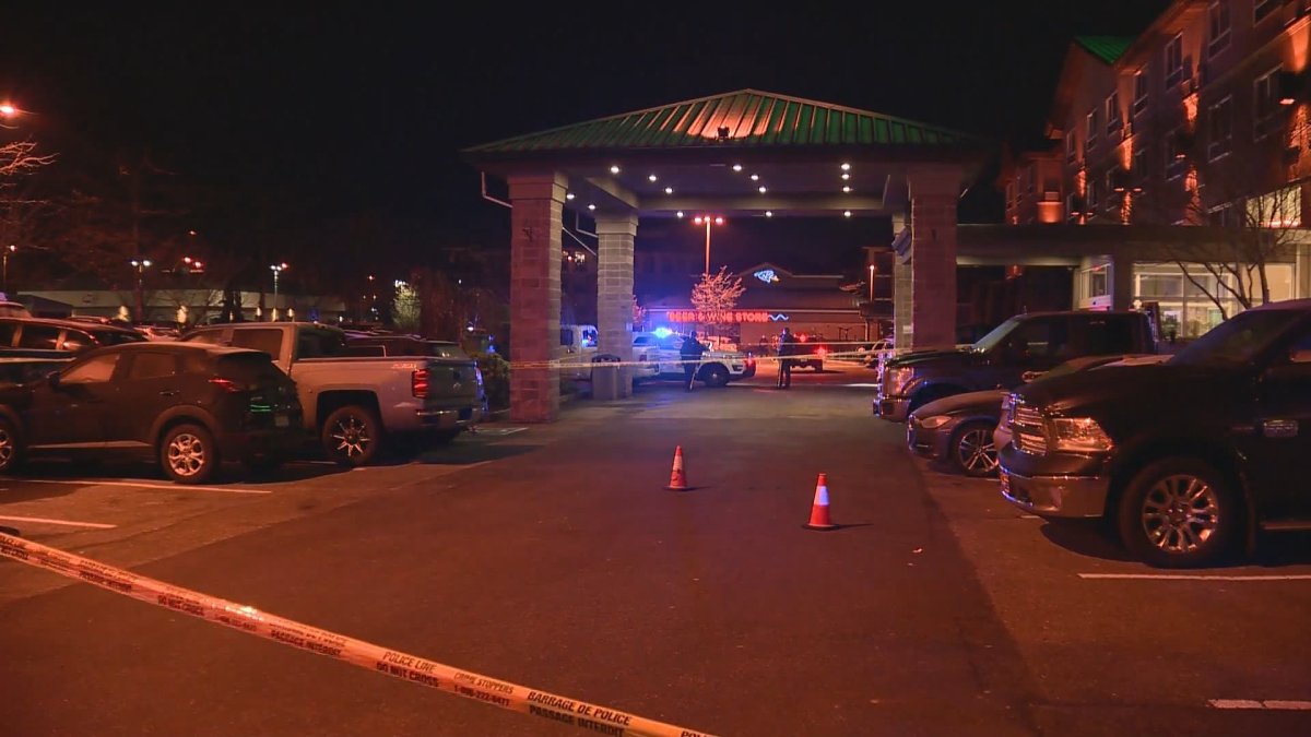 Langley RCMP investigate the scene of the stabbing in the parking lot of a popular bar and hotel early Saturday morning,.