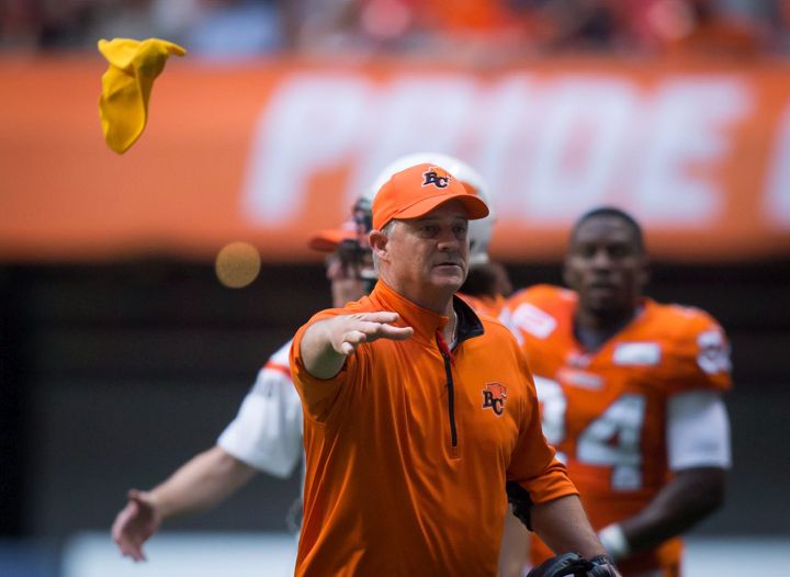 B.C. Lions' head coach Jeff Tedford throws a challenge flag during the first half of a CFL football game against the Saskatchewan Roughridersin Vancouver, B.C., on Friday July 10, 2015. The play was reversed in the Lions favour with a pass interference call against the Roughriders. 