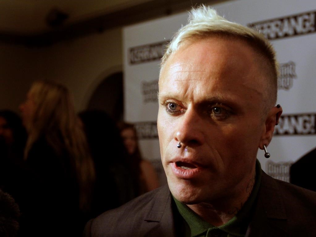 In this file photo dated Monday, Aug. 3, 2009, British musician Keith Flint of Prodigy talks to the media after winning the best single for ‘Omen’ at the Kerrang Awards 2009 at the Brewery in London. (AP Photo/Joel Ryan, FILE)