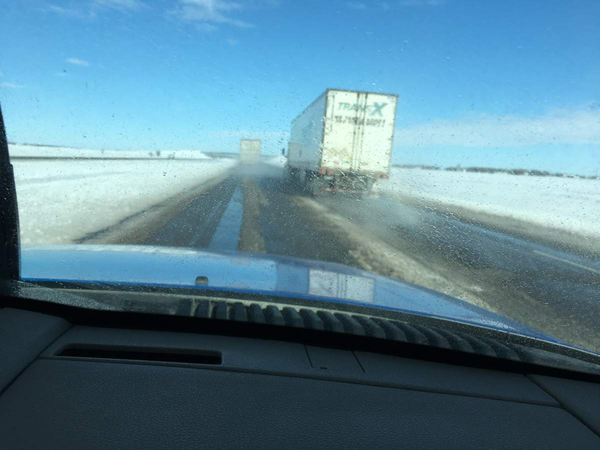 After being closed Wednesday and Thursday, roads north of Fargo were still treacherous due to frozen slush and ice patches
