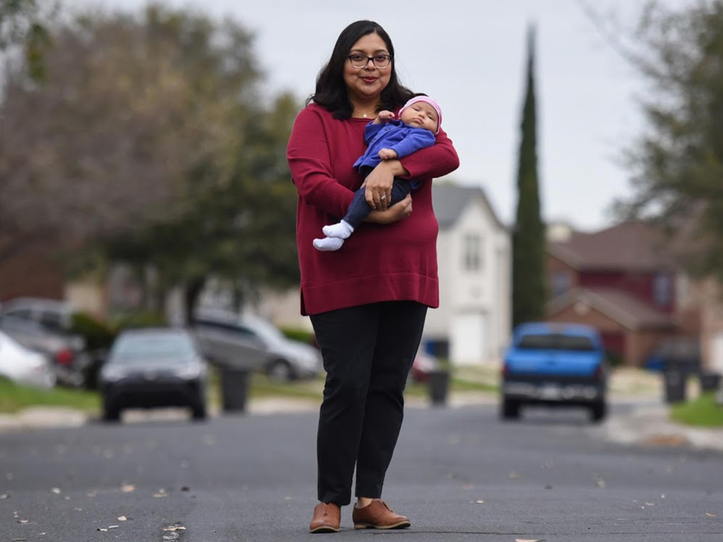 Blanca Eschbach, 32, a psychology coordinator at South Texas Children's home, and her daughter Olivia on her first day back at work.