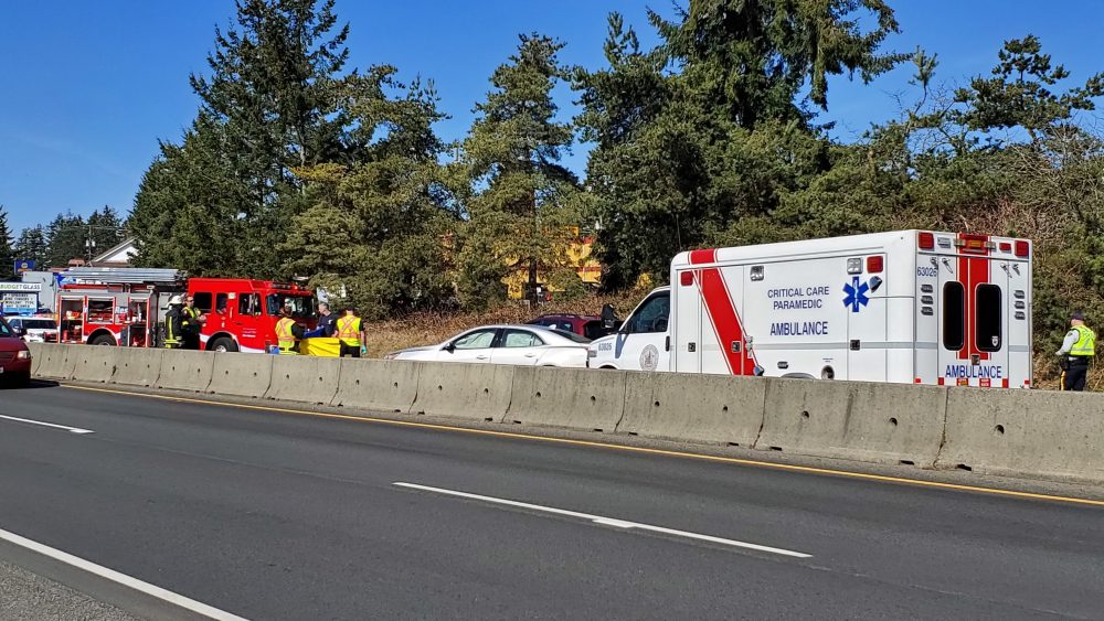 Police and paramedics respond to the scene of a three-vehicle crash in Nanaimo that killed a motorcyclist Friday.