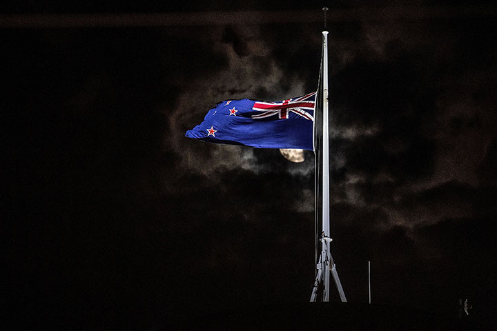 The New Zealand national flag is flown at half-mast on a Parliament building in Wellington on March 15, 2019, after a shooting attack in Christchurch.