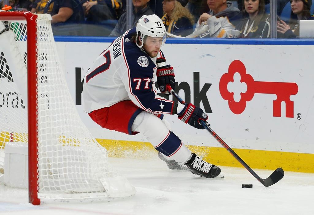 In this file photo, Josh Anderson (77), formerly of the Columbus Blue Jackets carries the puck behind the net during the second period of an NHL hockey game in 2019. Anderson has signed a seven-year deal with the Montreal Canadiens. Thursday, Oct. 8, 2020.
