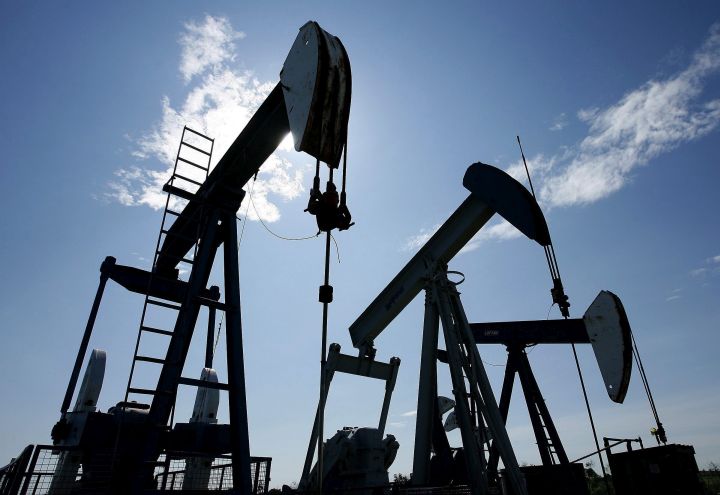 Pumpjacks are shown pumping crude oil near Halkirk, Alta., on June 20, 2007. Analysts say Canadian oilfield services companies with operations in the U.S. are now earning more of their revenue south of the border than they have for at least six years. In a report, AltaCorp Capital says that trend is expected to continue as ongoing oil and gas exploration and production spending weakness in Canada is balanced against steady activity in the United States. 