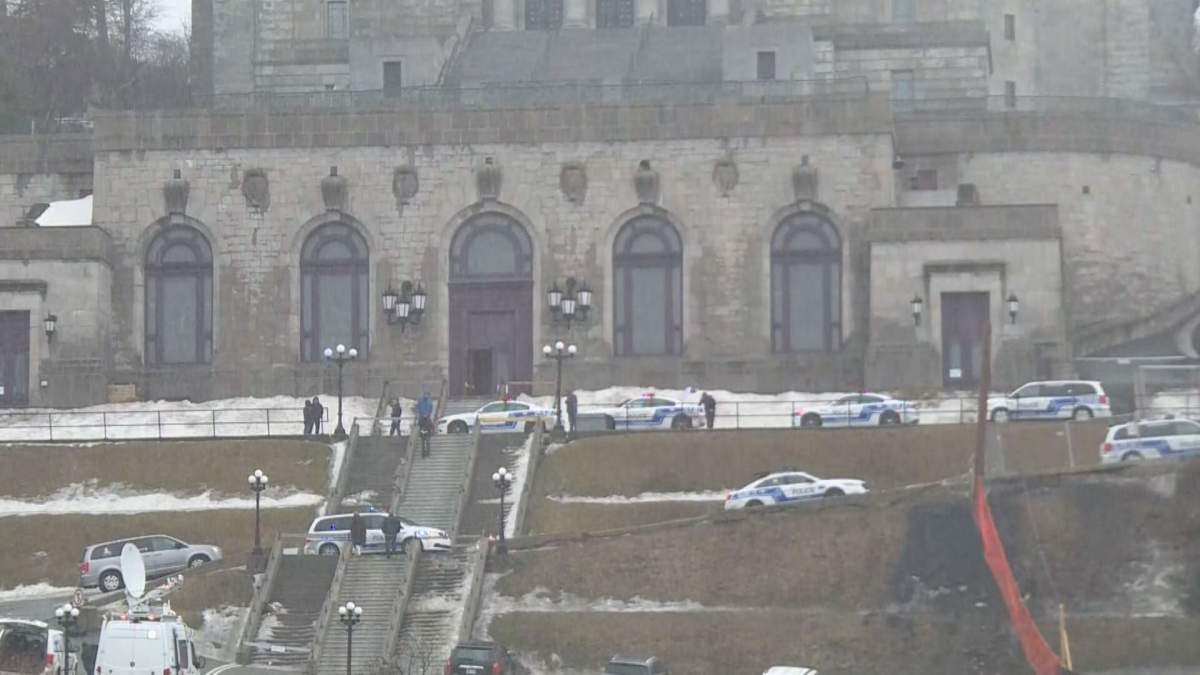 Montreal police officers flood Saint Joseph’s Oratory after an alleged assailant attacked Father Claude Grou.