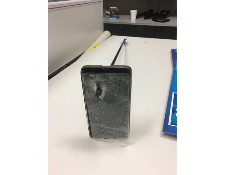 Australian man survives bow-and-arrow attack by using cellphone as shield - image