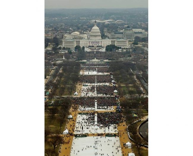 Attendees listen as Donald Trump speaks after being sworn in as the 45th president of the United States at the U.S. Capitol in Washington, Jan. 20, 2017.