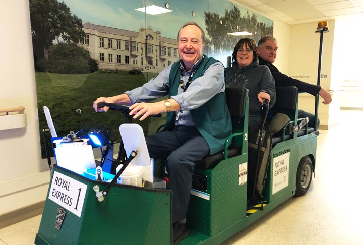 Volunteer driver Bert Gogal (left) gives people a lift on the new Royal Express at Royal University Hospital.