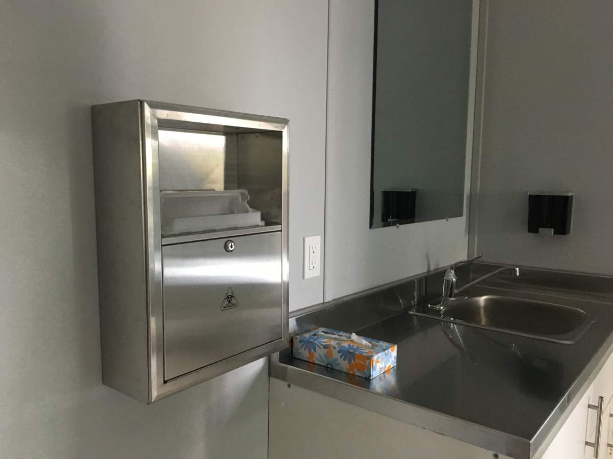 A box for depositing used needles in the “safe-use” room at the new shelter.