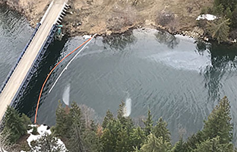 Booms deployed upstream from the Salmo and Pend d'Oreille Rivers Thursday following Wednesdays fuel tanker truck crash that sent 50,000 litres of fuel into the environment.