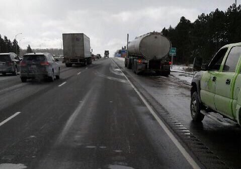 Police say the right, southbound lane of Highway 400 is closed after sewage was spilled onto the roadway.