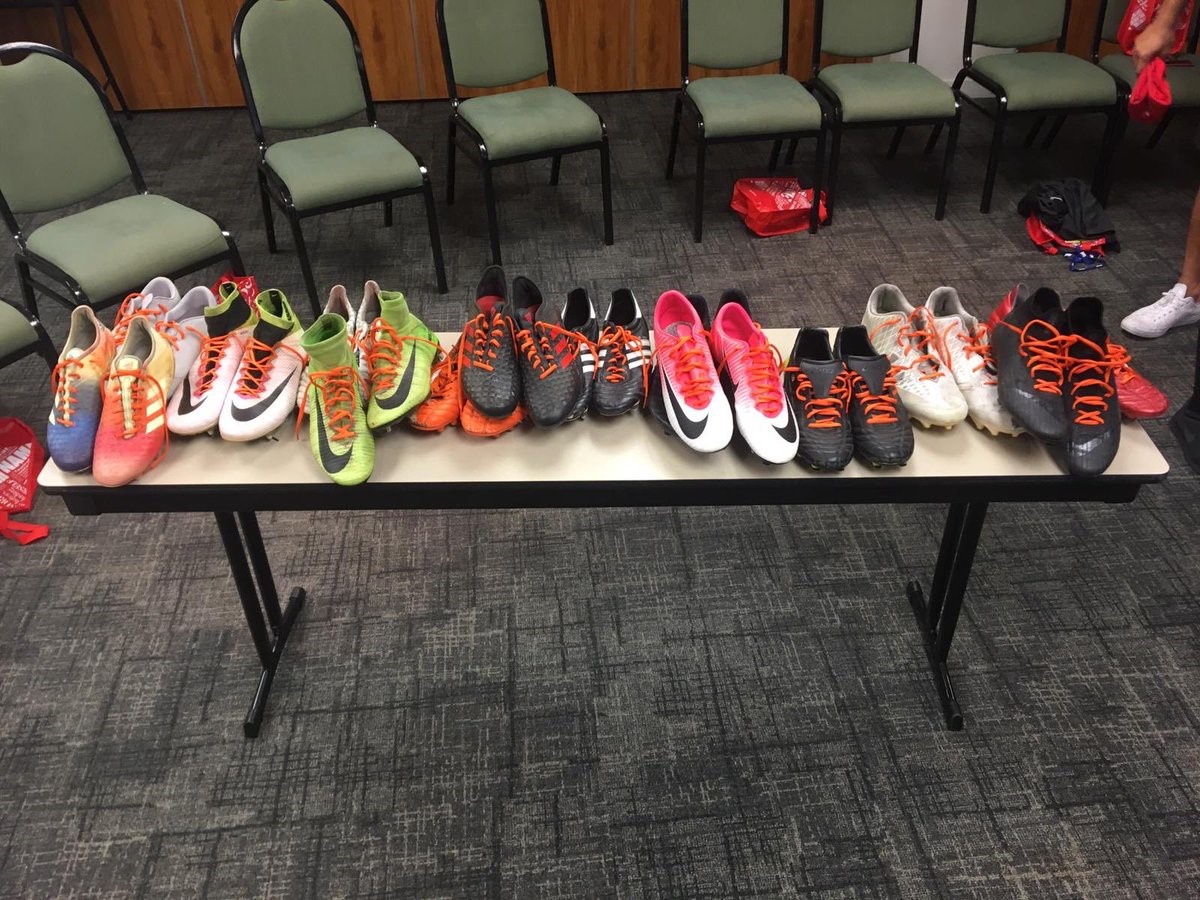 Team Canada\’s shoes with orange laces.