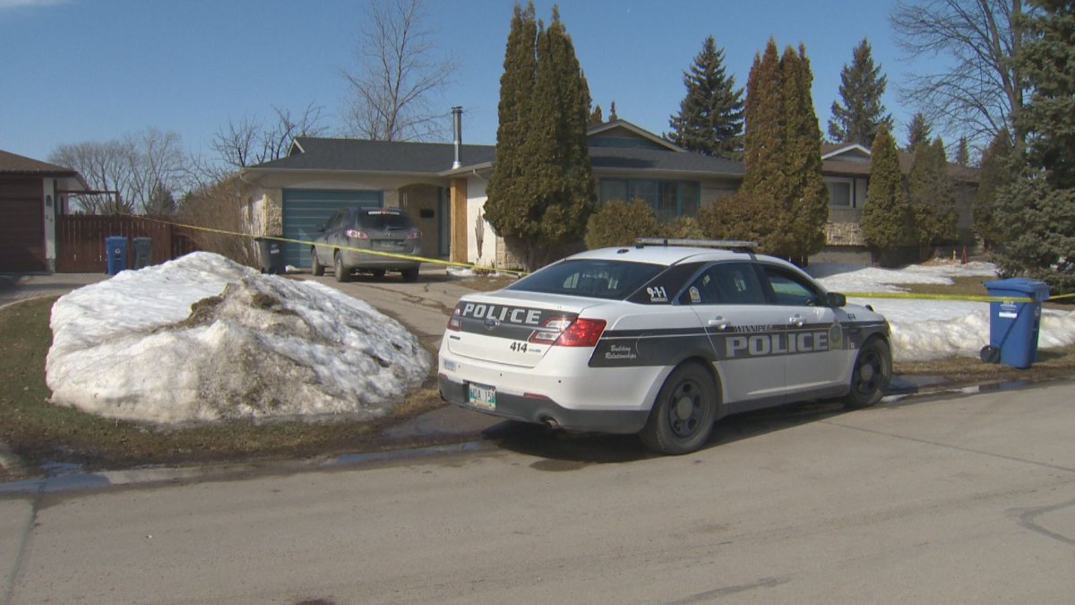 A Winnipeg police cruiser parked in front of a Southdale home where an injured woman was found.