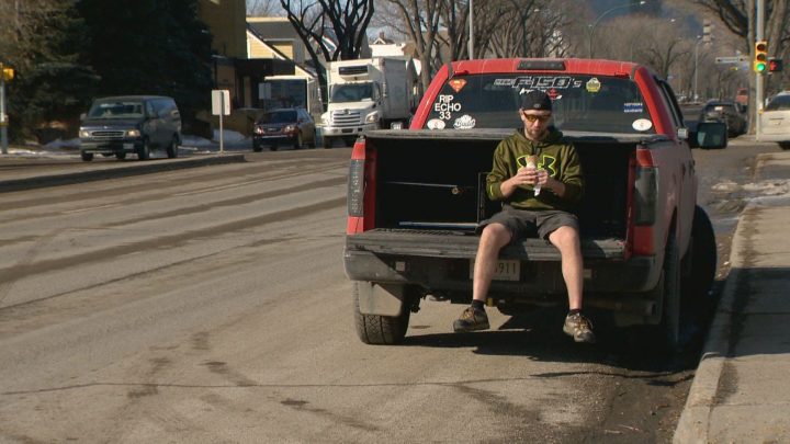Shawn Nelson, Milky Way’s first customer of 2019, eats his pistachio ice cream on the shop’s opening day.