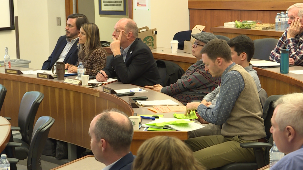 Kingston city councillors listen intently during a strategic planning meeting.