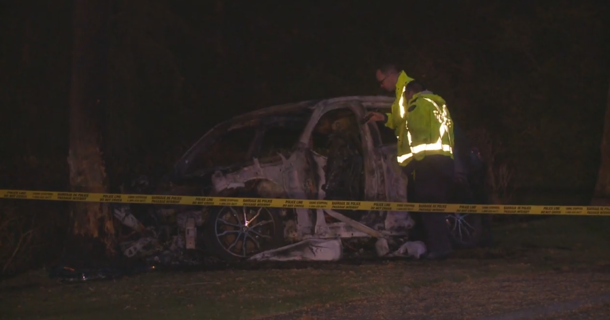 Two people were in the vehicle when it failed to negotiate a corner in Surrey, police said.
