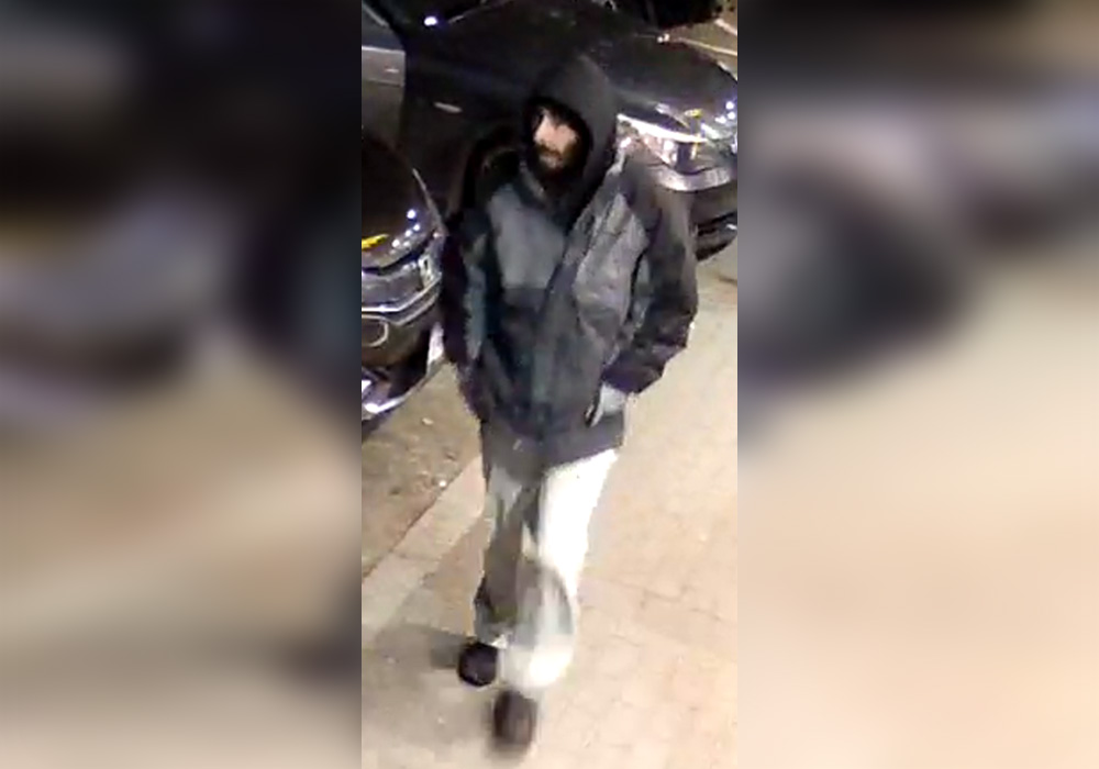 The suspect in an investigation involving a woman who was allegedly robbed at a downtown Surrey ATM is seen on surveillance video.