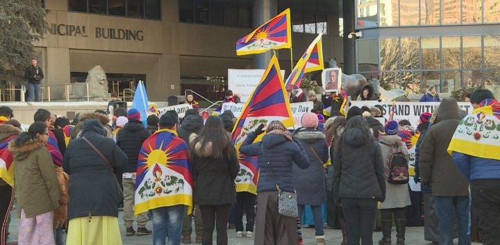 Calgarians made their way from city hall to the Chinese consulate on Sunday to rally behind Chinese-occupied Tibet.