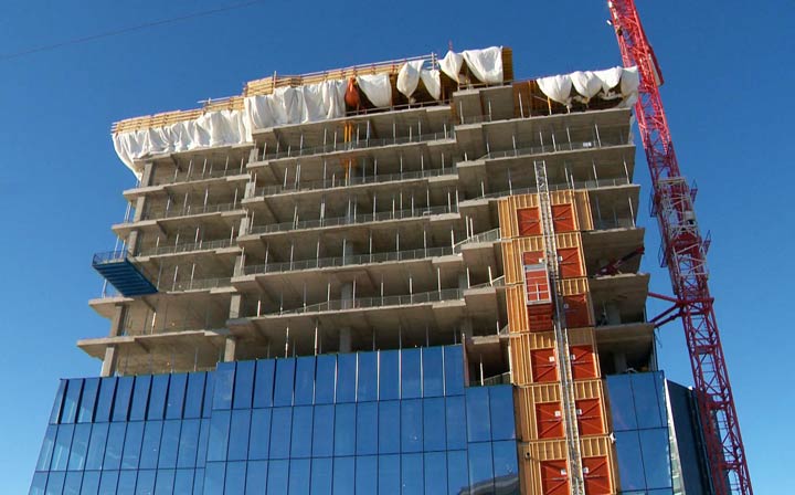 Two towers currently under construction in Saskatoon will have a trickle-down effect on commercial real estate once opened, according to a recent CBRE report.