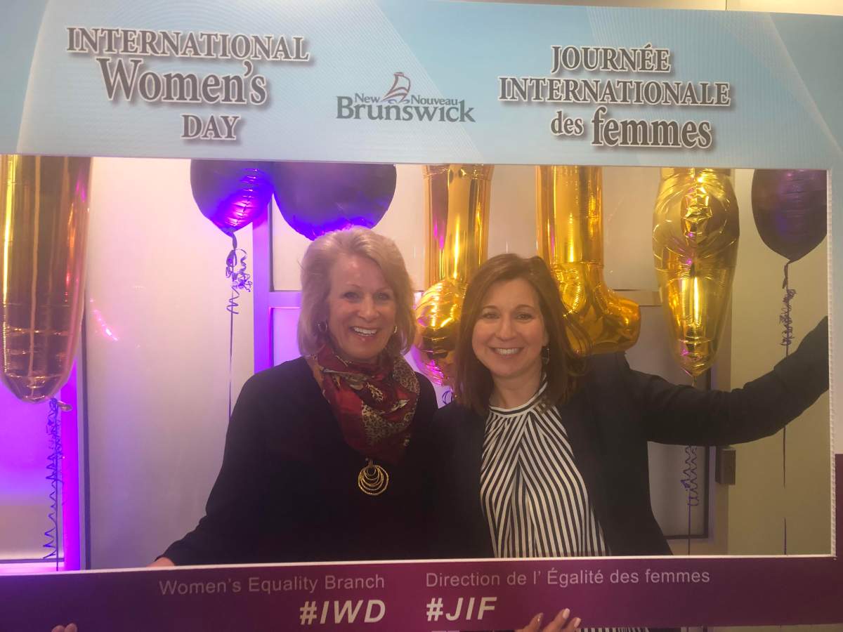 New Brunswick Attorney General Andrea Anderson-Mason and Service New Brunswick Minister Sherry Wilson celebrate International Women’s Day.