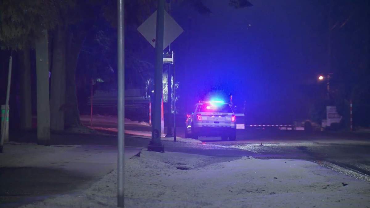 Police outside Burnaby's Confederation Park Wednesday night in response to multiple shots fired.