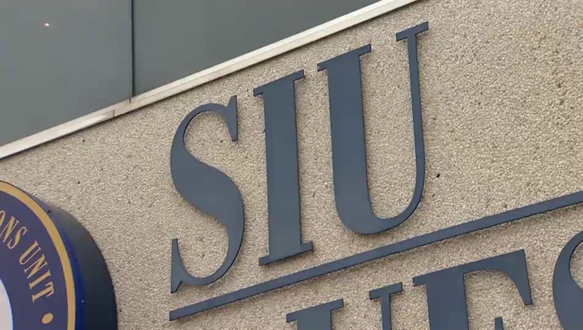 A closeup of the sign for the SIU's offices.