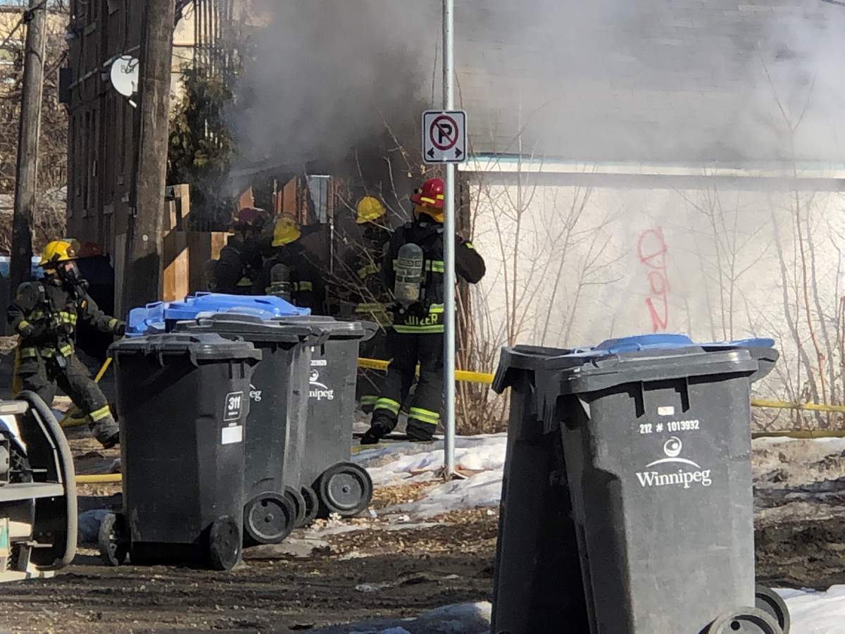Fire crews on Maryland Street tackle a morning garage fire.