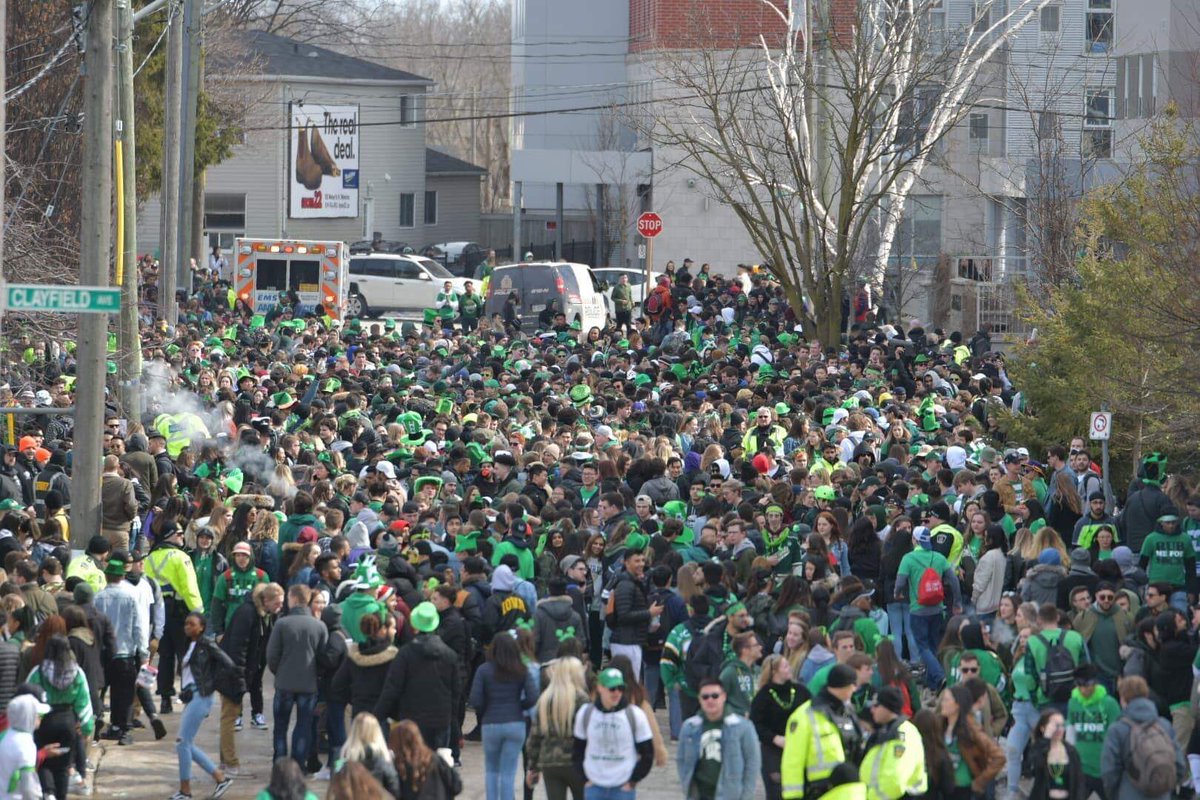 Crowds of people take over Ezra and Bricker avenues in Waterloo on St. Patrick's Day in 2019.
