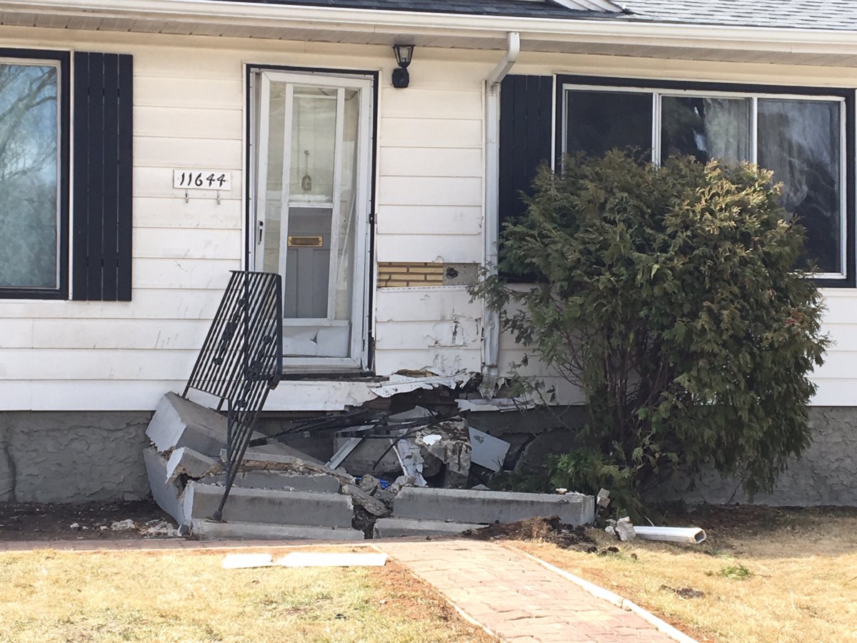The aftermath of a single-vehicle collision involving a truck and house in west Edmonton April 17, 2019.