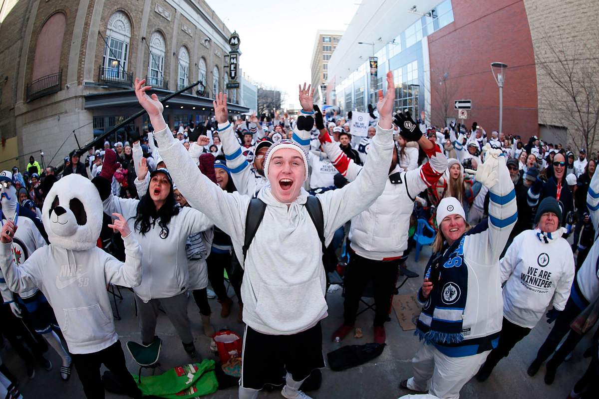 Winnipeggers attend the "White Out Street Party"