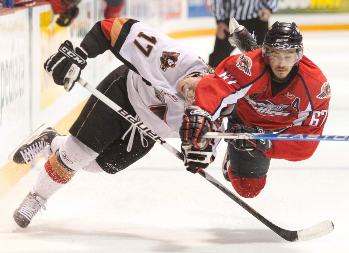 Giffen Nyren, left, played four seasons in the WHL, including half a season with the Calgary Hitmen, who went on to play in the 2010 Memorial Cup in Brandon, Man., as WHL champions.  At right is Eric Wellwood of the OHL champion Windsor Spitfires.