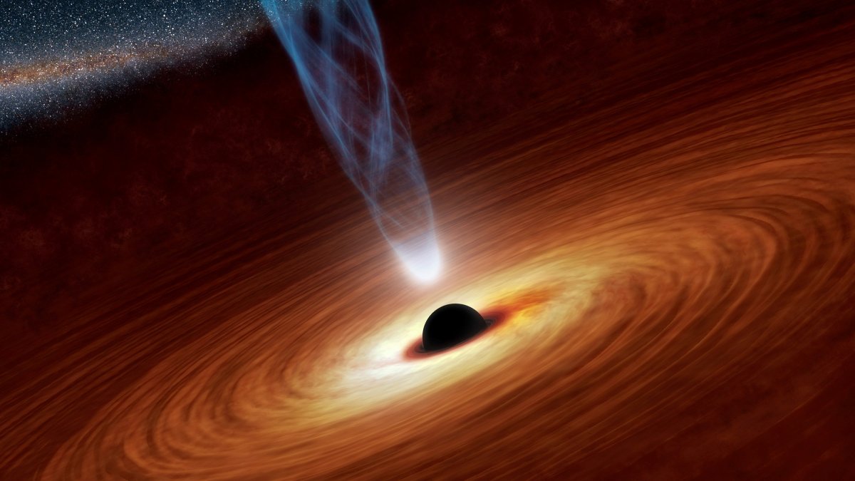 A supermassive black hole with millions to billions times the mass of our sun is seen in an undated NASA artist's concept illustration. 