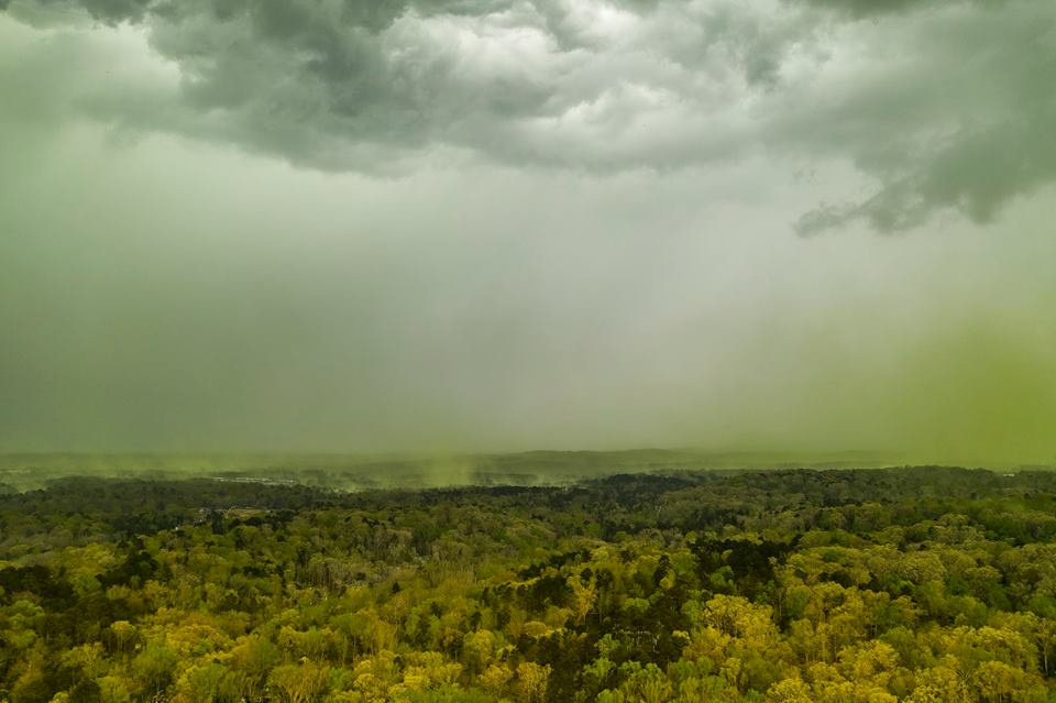 An aerial view shows rainfall over a pollen-affected area in Durham, North Carolina, U.S., April 8, 2019, in this picture obtained from social media. Jeremy Gilchrist/via Reuters