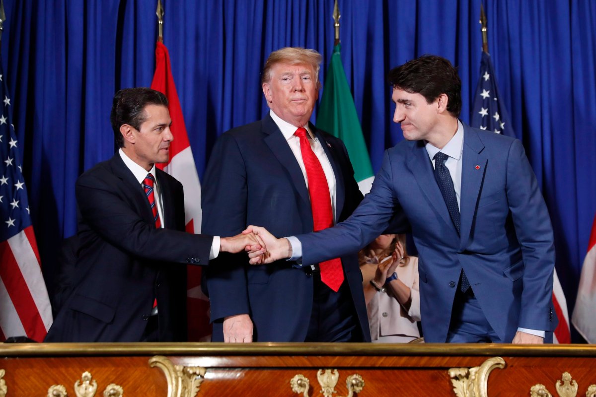 U.S. President Donald Trump, Canada's Prime Minister Justin Trudeau, right, and Mexico's President Enrique Pena Nieto, left, participate in the USMCA signing ceremony, Friday, Nov. 30, 2018.