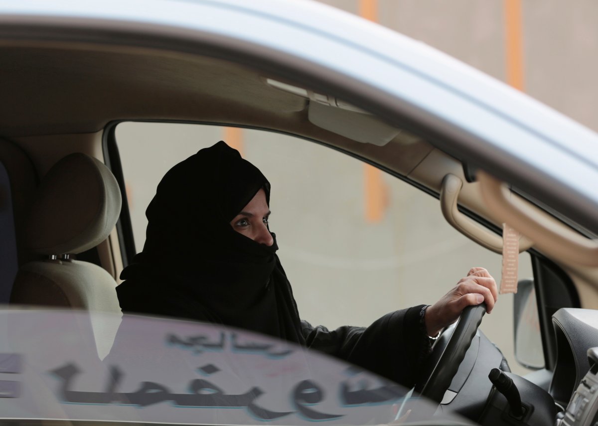 FILE - In this March 29, 2014 file photo, Aziza al-Yousef drives a car on a highway in Riyadh, Saudi Arabia, as part of a campaign to defy Saudi Arabia's then ban on women driving.
