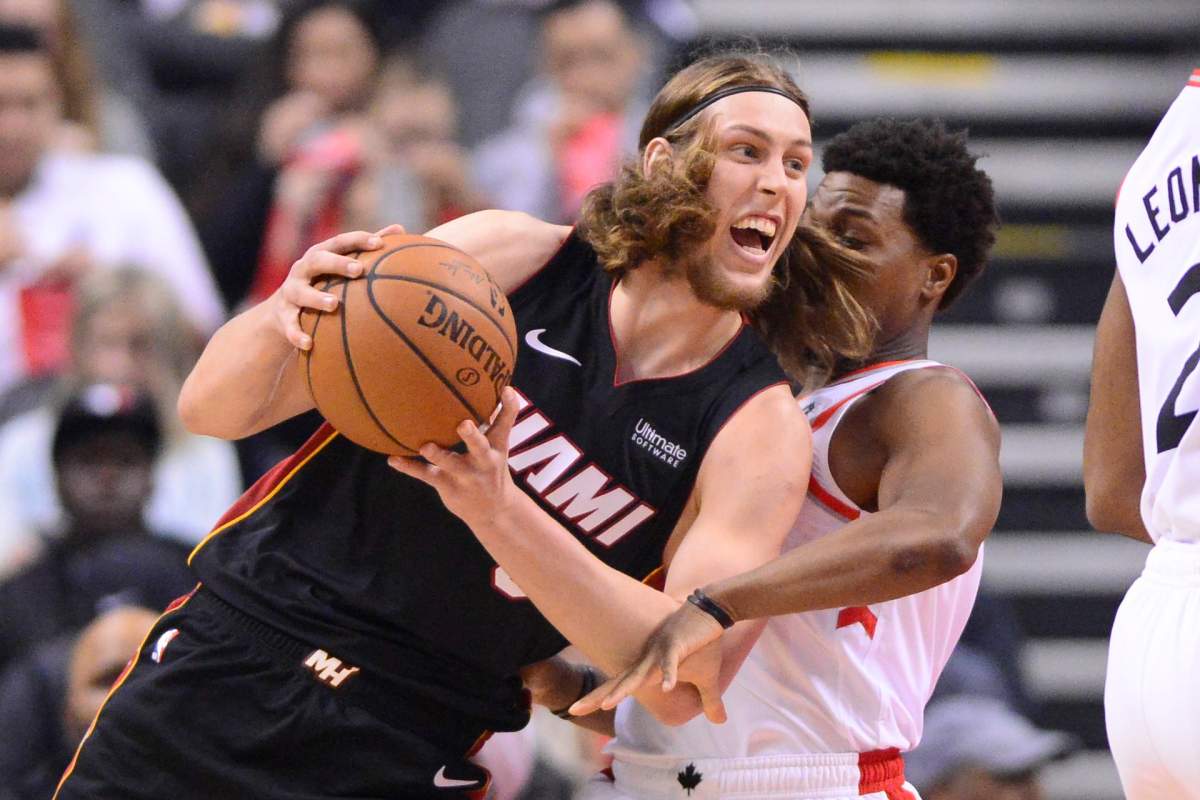 Miami Heat forward Kelly Olynyk (9) drives to the net against Toronto Raptors guard Kyle Lowry (7) during first half NBA basketball action in Toronto on Sunday, April 7, 2019. THE CANADIAN PRESS/Frank Gunn