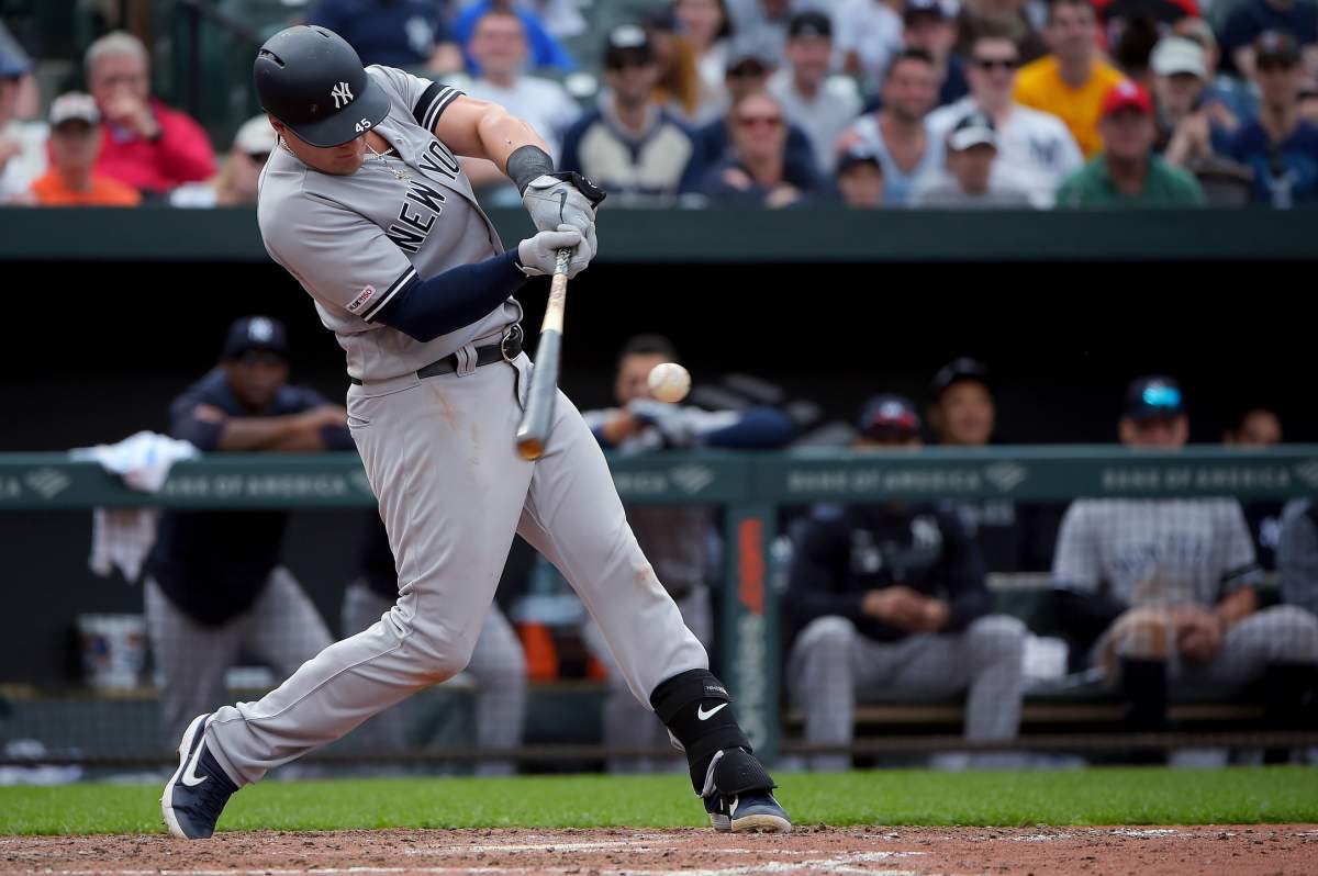 New York Yankees’ Luke Voit hits a single in the ninth inning of the team’s baseball game against the Baltimore Orioles, Sunday, April 7, 2019, in Baltimore. (AP Photo/Will Newton)