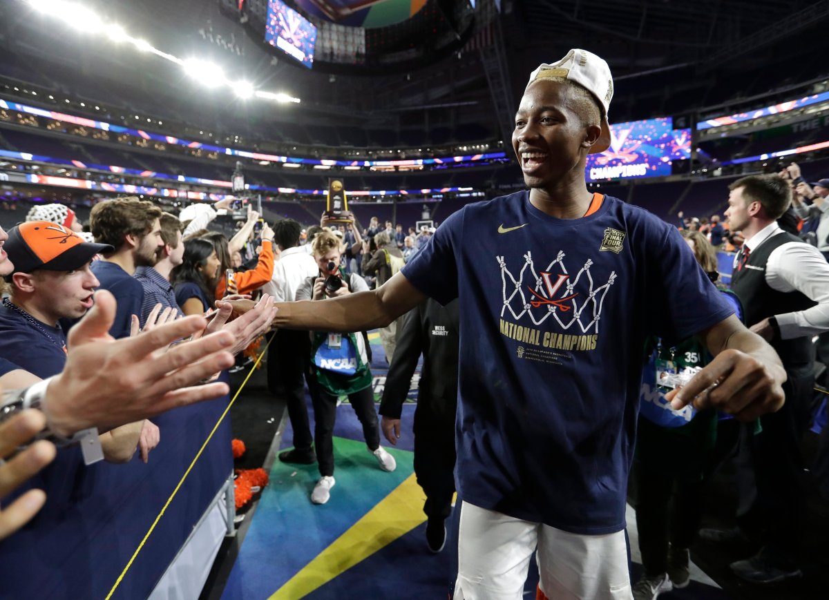 Virginia forward Mamadi Diakite celebrates with fans after the championship game against Texas Tech in the Final Four NCAA college basketball tournament, Monday, April 8, 2019, in Minneapolis. 