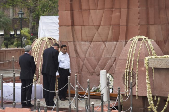 British High Commissioner to India Dominic Asquith, second left, pays homage to commemorate century of the Jallianwala Bagh incident, in Amritsar, India, Saturday, April 13, 2019.