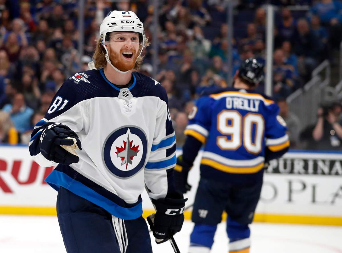Winnipeg Jets' Kyle Connor celebrates after scoring as St. Louis Blues' Ryan O'Reilly (90) skates in the background during the third period in Game 3 of an NHL first-round hockey playoff series Sunday, April 14, 2019, in St. Louis. The Jets won 6-3. 