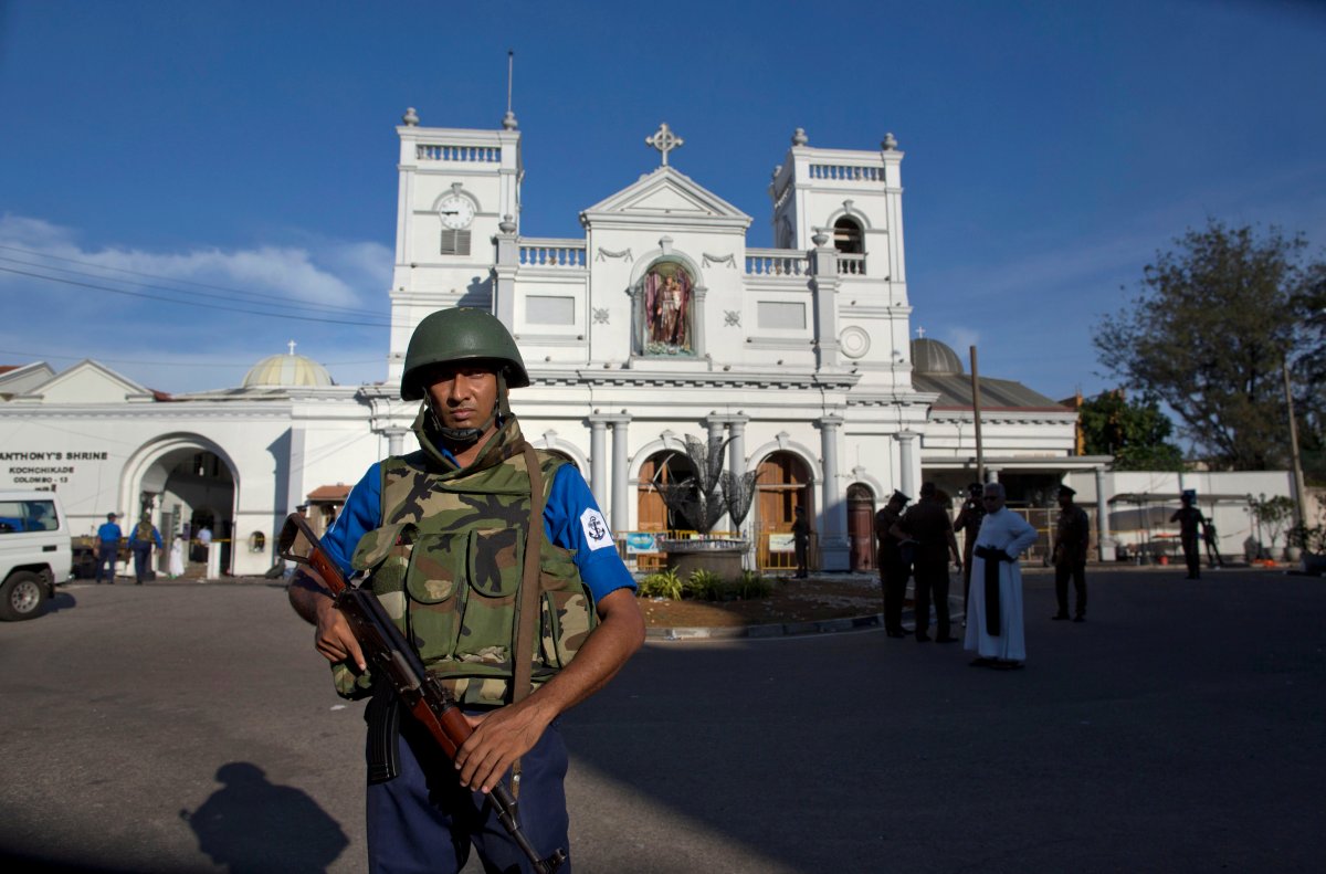 Sri Lankan air force officers and clergy stand outside St. Anthony's Shrine, a day after a blast in Colombo, Sri Lanka, Monday, April 22, 2019. Easter Sunday bombings of churches, luxury hotels and other sites was Sri Lanka's deadliest violence since a devastating civil war in the South Asian island nation ended a decade ago.