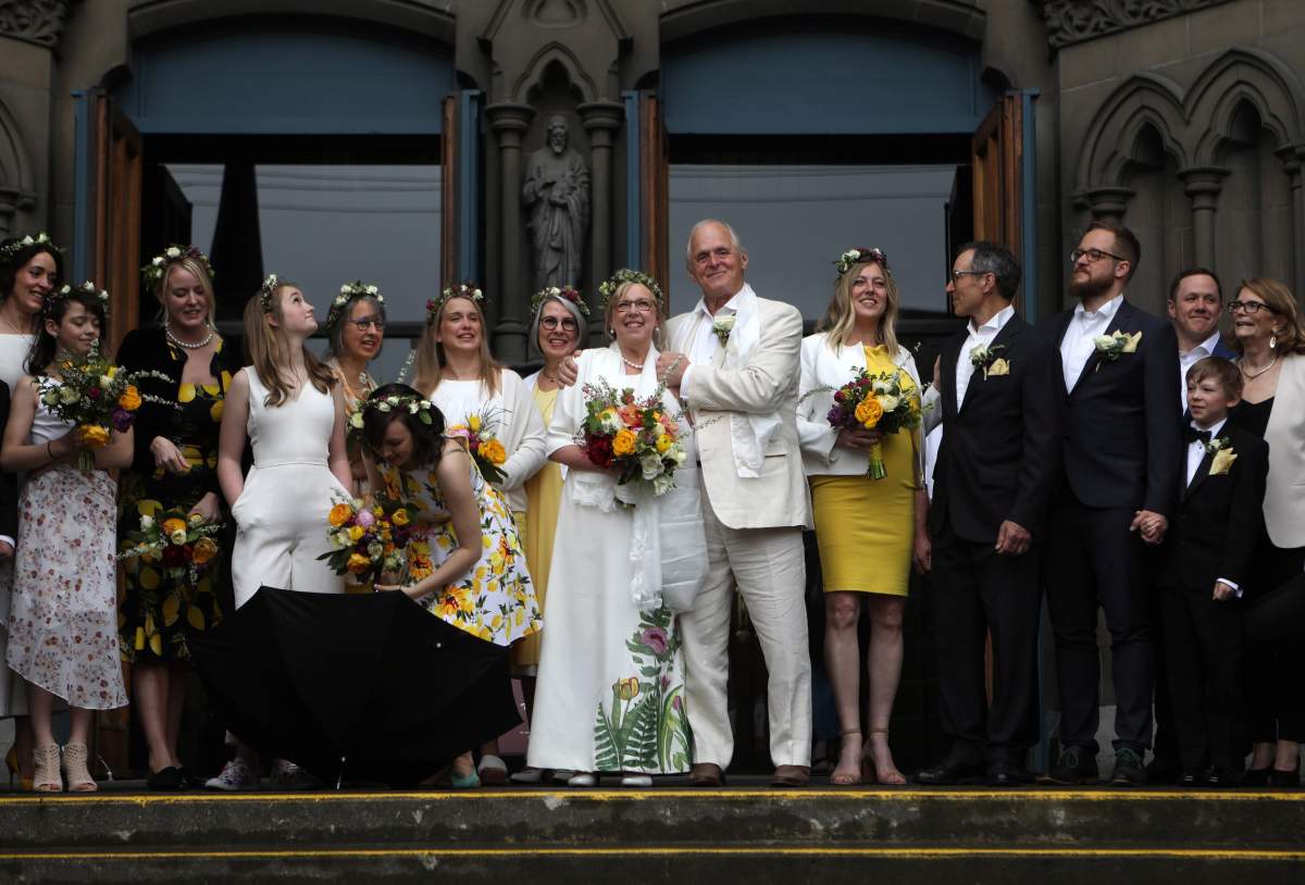 Federal Green Party leader Elizabeth May and her husband John Kidder greet the public following their marriage during Earth Day at the Christ Church Cathedral in Victoria, B.C., on Monday, April 22, 2019.