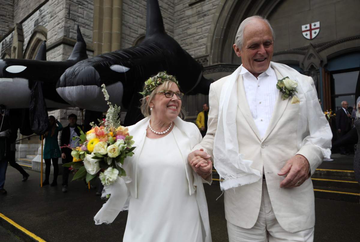 Federal Green Party leader Elizabeth May and her husband John Kidder greet the public following their marriage during Earth Day at the Christ Church Cathedral in Victoria, B.C., on Monday, April 22, 2019.