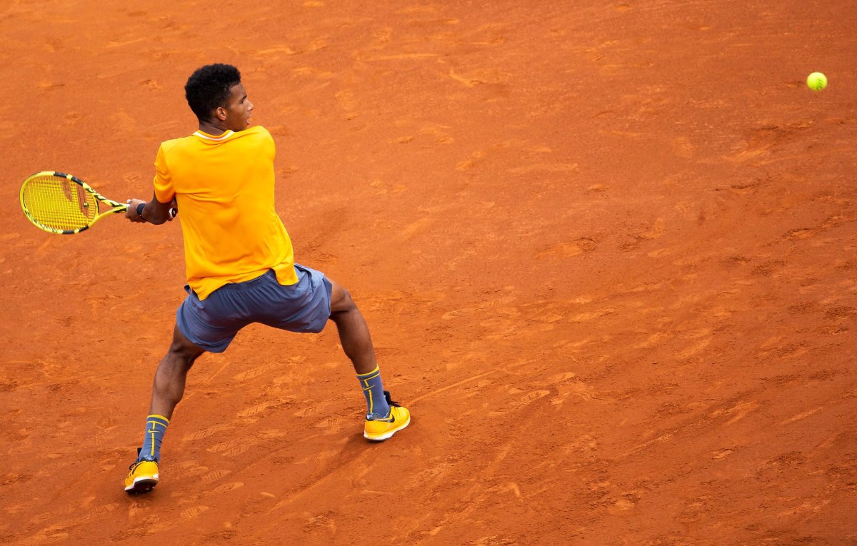 Félix Auger-Aliassime of Canada in action against Kei Nishikori of Japan during their third round men's single match of the 67th Barcelona Open Trofeo Conde de Godo tennis tournament in Barcelona, Spain, 25 April 2019. 